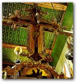Suspended above the gilded iconostasis in the central aisle 
