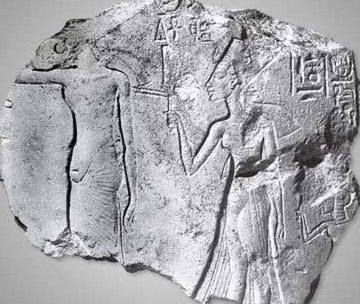 Fragment of limestone showing Akhenaten (left) and Nefertiti (right), clearly with different treatments of the genital region