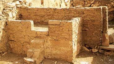 A worker's house at Deir el-Medina showing a feature that may have served both as a bed and a domestic altar