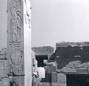 On the northern pillar, the king wears the red crown and is embraced first by hathor and then below by Amun
