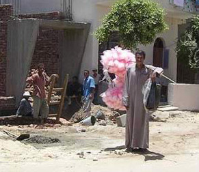 A candy man walks the streets on the West Bank at Luxor